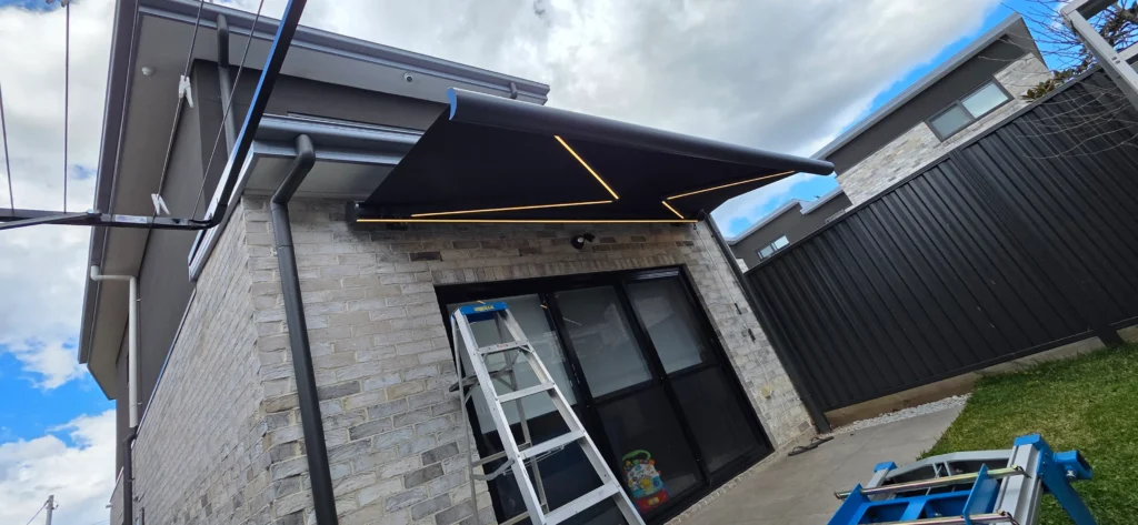 Motorised outdoor awning providing shade at a Liverpool NSW property